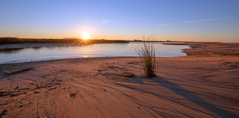 Sunrise reflecting in the Santa Clara river tidal inlet at McGrath State Park in Ventura - Oxnard on the California Gold coast United States