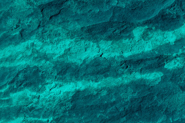 Sandstone background and texture in neon green
