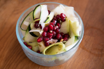 Bowl of salad with pomegrante