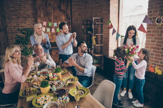 Close up photo of gathered relatives in decorated house dinner t