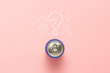 Tin can with a drink on a pink background with a question mark. minimalism. Concept of an unknown...
