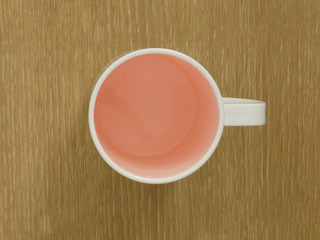 red cup on wooden table