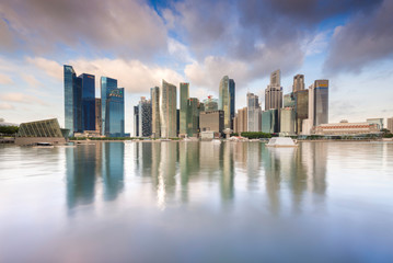 Naklejka na ściany i meble Reflection of skyscrapers around the Marina Bay in Singapore.