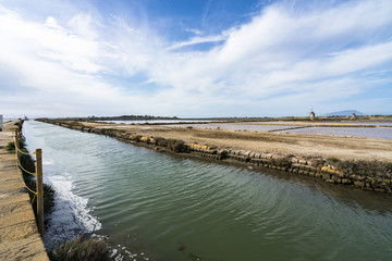 Canal along the salt lagoons of “Saline dello Stangone” near Marsala, Sicily, Italy