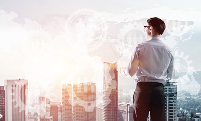 Concept of business success and control with confident boss against cityscape background