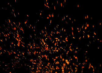 flame of fire with sparks on a black background