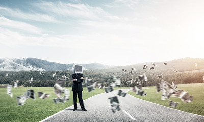 Businessman with monitor instead of head.
