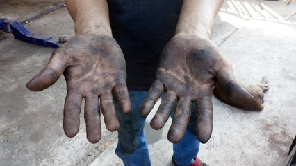 Hands, black and dirty car mechanic from work.