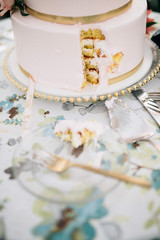 beautiful elegant wedding cake with a slice cut