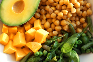 Chickpea and fresh vegetables on plate, closeup
