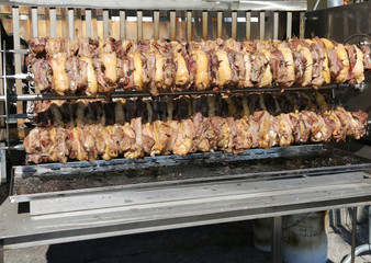 skewers of meat while cooking slowly in the rotisserie during th
