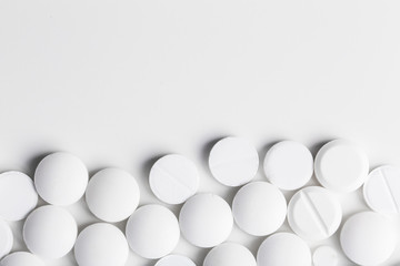 Round pills on white background