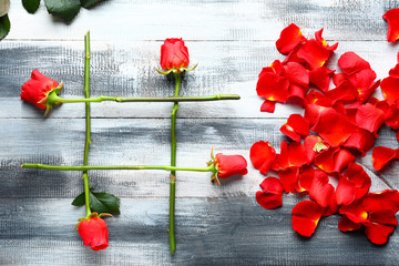 Hashtag sign made of flowers on wooden background