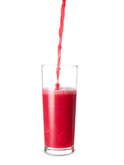 Pouring of healthy juice into glass on white background