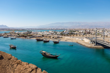 Traditional wooden dhow boats in Sur, Oman - obrazy, fototapety, plakaty