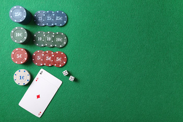 Chips, dices and cards on table in casino