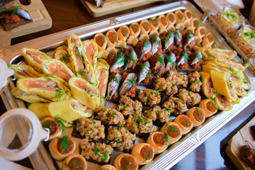 Varied food buffet table. The appetizers are exquisite for the reception.