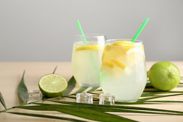 Glasses of fresh lemonade on table