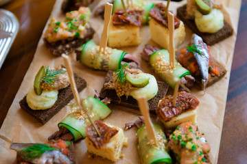 Varied food buffet table. The appetizers are exquisite for the reception.