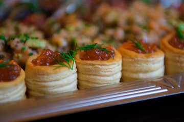 Varied food buffet table. The appetizers are exquisite for the reception.