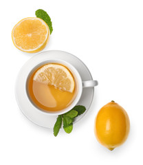 Cup of hot tea with lemon on white background