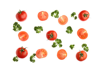 Cut tomatoes and parsley on white background