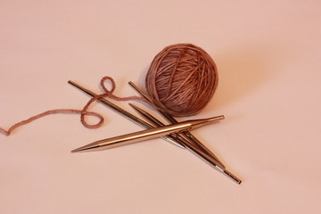 composition with balls of yarn and knitting.
