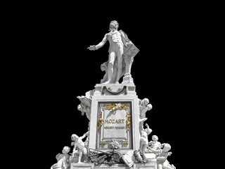 Sculpture of Wolfgang Amadeus Mozart is isolated on black background. Monument was created by...