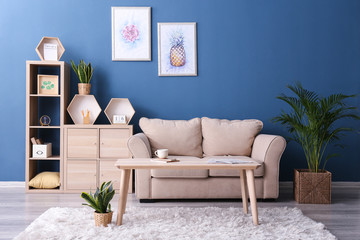 Interior of room with comfortable sofa and wooden table