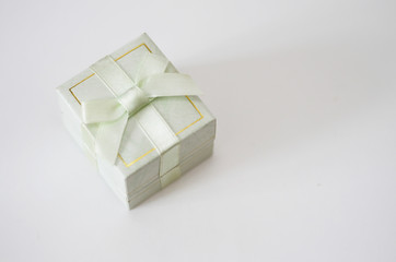 gift box with a bow stands on a white background