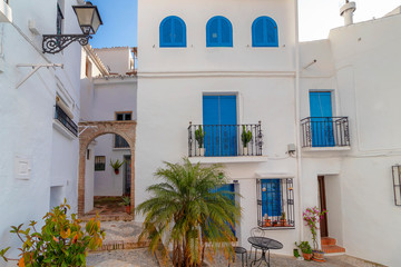 Charming narrow historic streets of white village Frigiliana in Malaga province, Andalusia, Spain