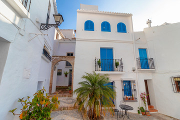 Charming narrow historic streets of white village Frigiliana in Malaga province, Andalusia, Spain