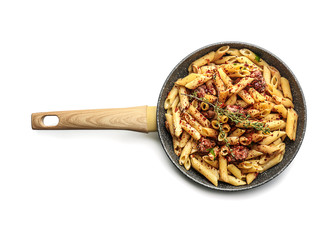 Tasty pasta with meat and spices in pan on white background
