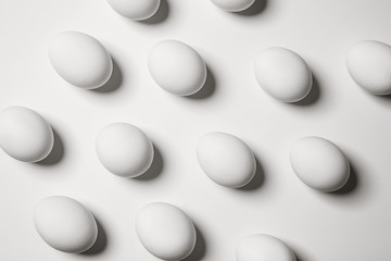Many chicken eggs on white background