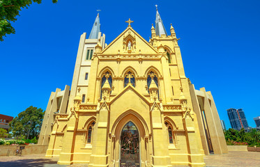 Fototapeta na wymiar Facade of St Mary's Cathedral in Perth, Western Australia. The Cathedral of the Immaculate Conception of the Blessed Virgin Mary in neogothic style is of Christian Catholic religion. Front view.