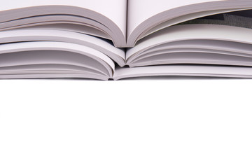 An open book on white desk