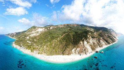 Aerial drone panoramic photo of tropical caribbean bay with white sand beach and beautiful turquoise and sapphire clear sea