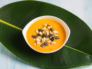 Bean squash creamy soup served with seeds and nuts