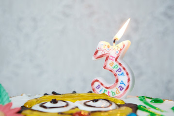Birthday cake with burning candle тгьиук еркуу on grey background