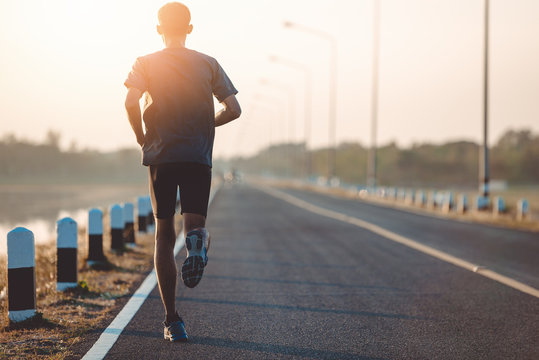 Athlete Runner Feet Running On Road