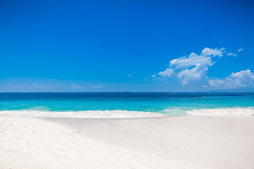 Tropical beach with white sand and blue ocean in Maldives