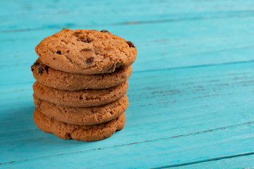 stack of sweet cookies on blue background