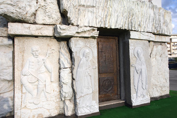 Forged, metal cross and door, stone carving. Orthodox temple Cathedral of the Resurrection of...