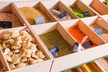 Close view of grocery products on a wooden shelf