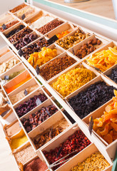 Top view of various dry fruit, raisins and nuts at the shop