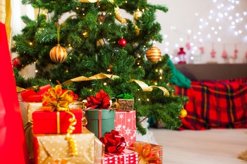 Christmas presents heap, lights on the Christmas tree