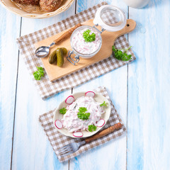 delicious homemade meat salad with mayonnaise and cucumber