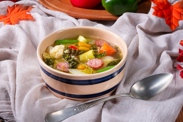 delicious autumnal vegetable soup with sausage and bacon