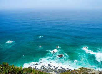 Cabo de Roca, Atlantic ocean, high cliffs and turquoise water. Panoramic view.