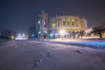 Fototapeta na wymiar Snowstorm in the night city. Opera and Ballet Theatre. Odessa. Ukraine. 